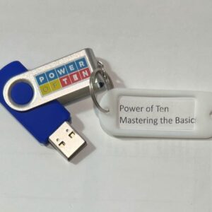 A picture of a USB drive with a keyring on it that has an attached label reading Power of Ten Mastering the Basics.